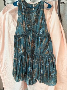 Tunic/top by free people. Size large, flowers and birds, so pretty